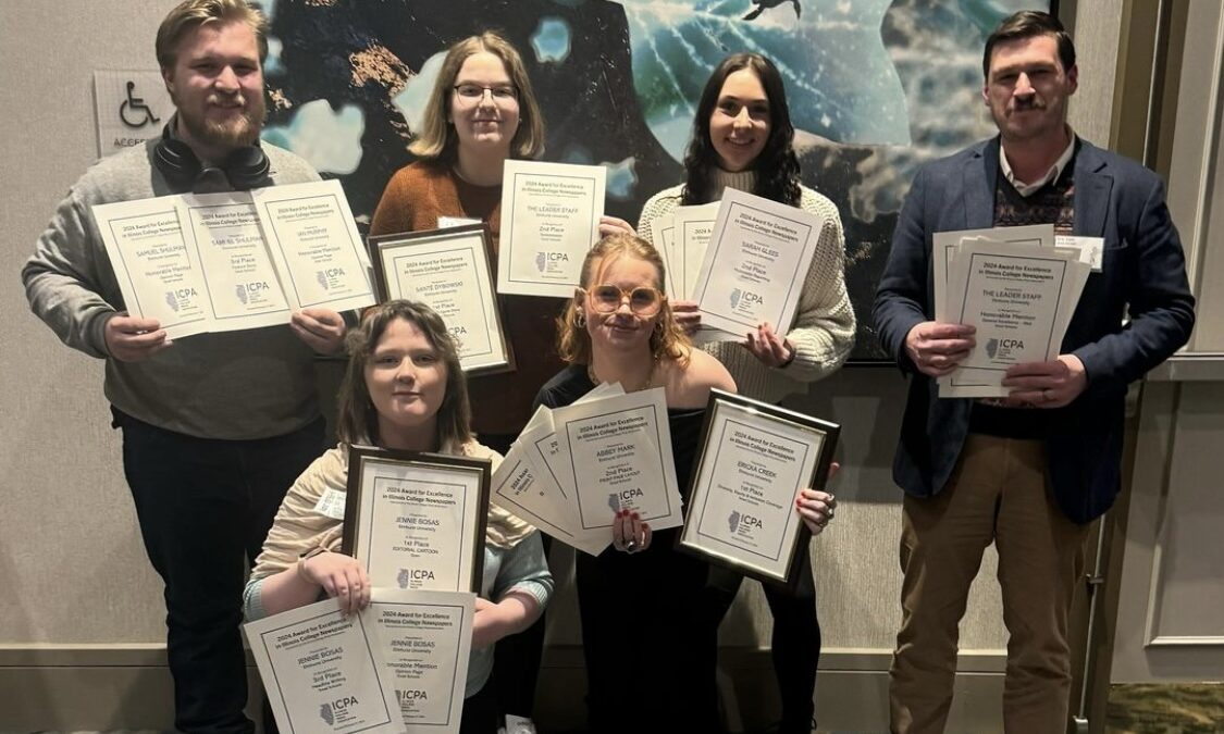 The Leader Editorial Board poses with their awards at the Illinois College Press Association contest.